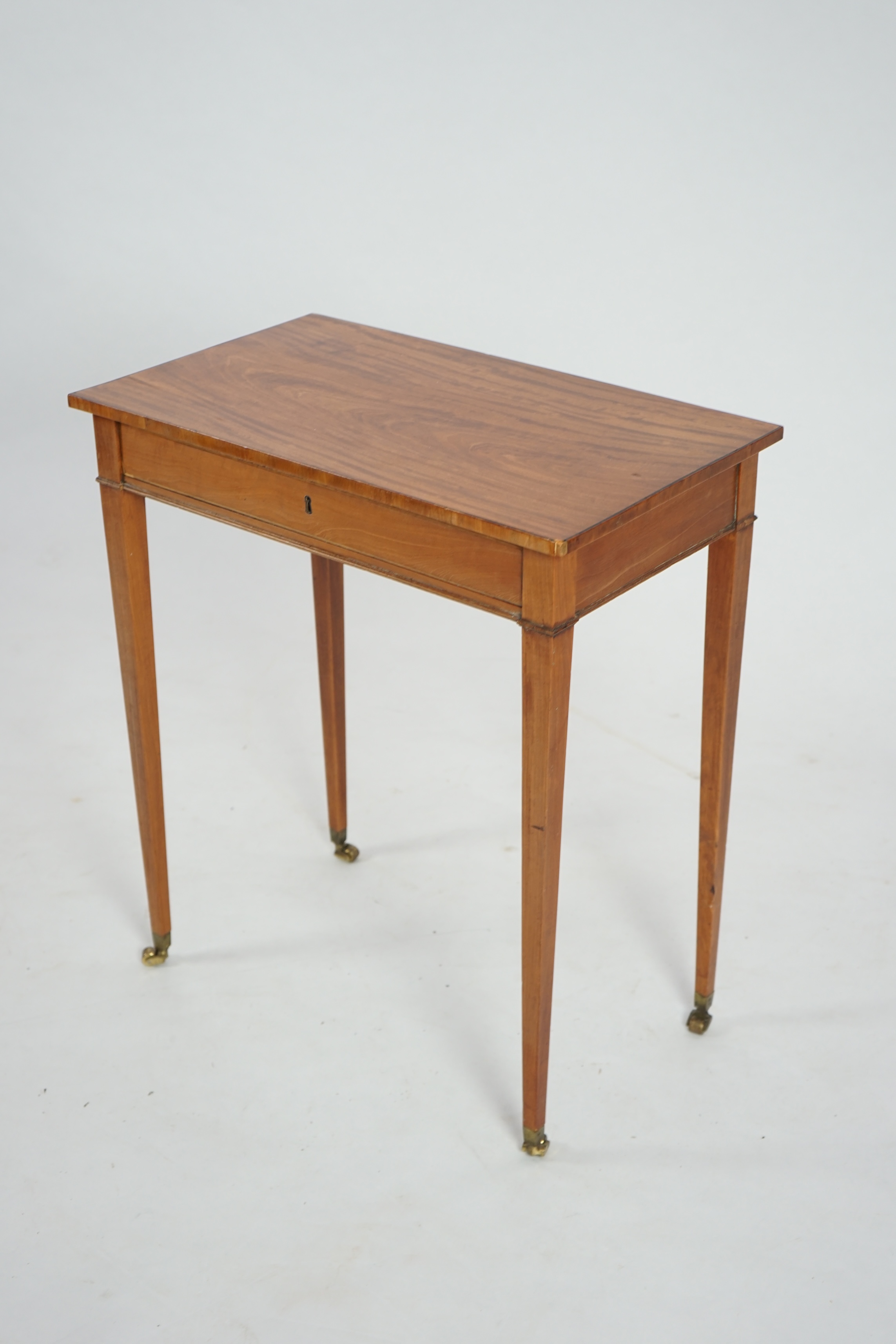 An Edwardian satinwood occasional table